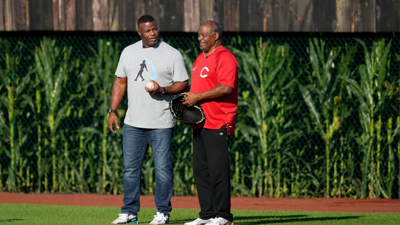 Hall of Fame baseball player and former Cincinnati Reds center fielder Ken Griffey Jr., left, asks his dad and fellow Hall of