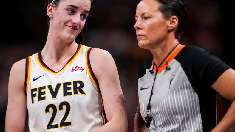 Indiana Fever guard Caitlin Clark (22) smiles at an official Wednesday, Aug. 28, 2024, during a game between the Indiana Fever