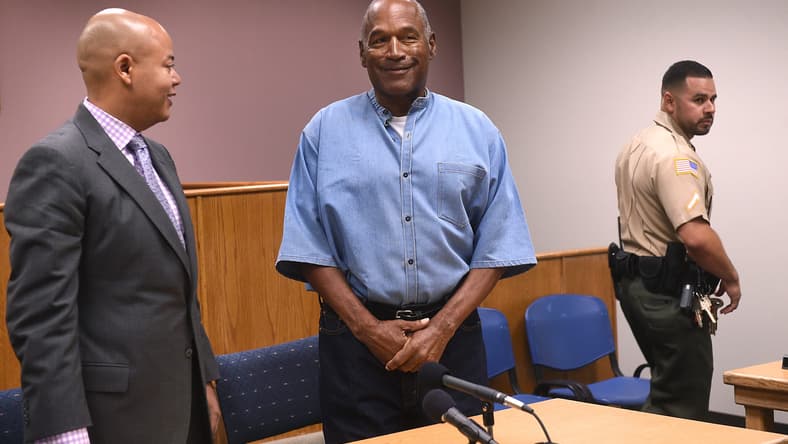 O.J. Simpson reacts after learning he will be granted parole during a hearing at Lovelock Correctional Center on July 20, 2017.