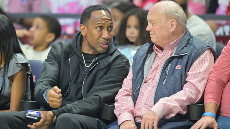 Stephen A. Smith, left, talks with a fan at Ole Miss vs. LSU in a NCAA women’s college basketball game at the Sandy and John