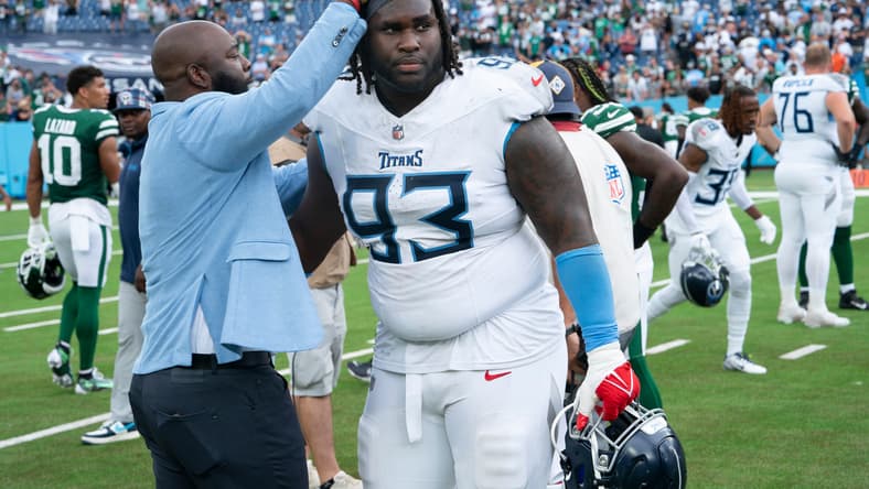 Tennessee Titans General Manager Ran Carthon greets Tennessee Titans defensive tackle T'Vondre Sweat (93) after their 24-17 loss