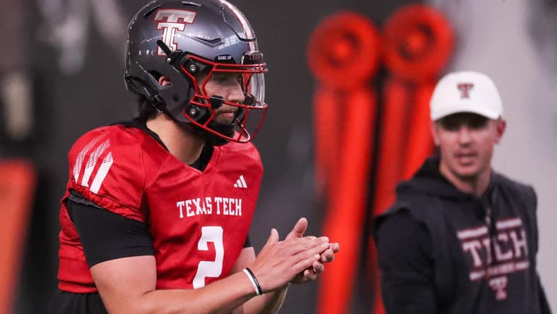 Texas Tech's Brendan Sorsby goes through a drill as offensive coordinator Mack Leftwich looks on during spring football