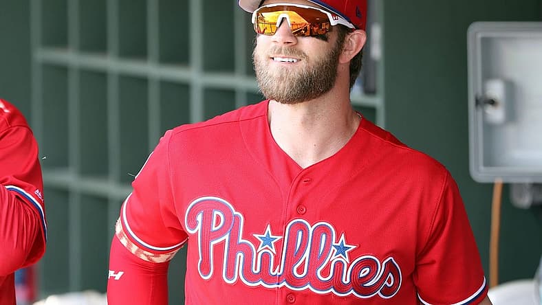 Mar 11, 2019; Clearwater, FL, USA; Philadelphia Phillies right fielder Bryce Harper (3) smiles in the dugout before  the game against the Tampa Bay Rays at Spectrum Field. Mandatory Credit: Kim Klement-USA TODAY Sports