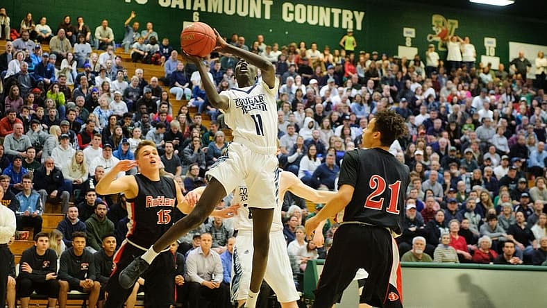 MMU's Taylor Bowen (11) leaps for lay up during the boys DI semi final basketball game between the Rutland Raiders and the Mount Mansfield Cougars at Patrick Gym on Monday night March 11, 2019 in Burlington, Vermont.
Rutland Vs Mmu Boys Basketball 03 11 19
