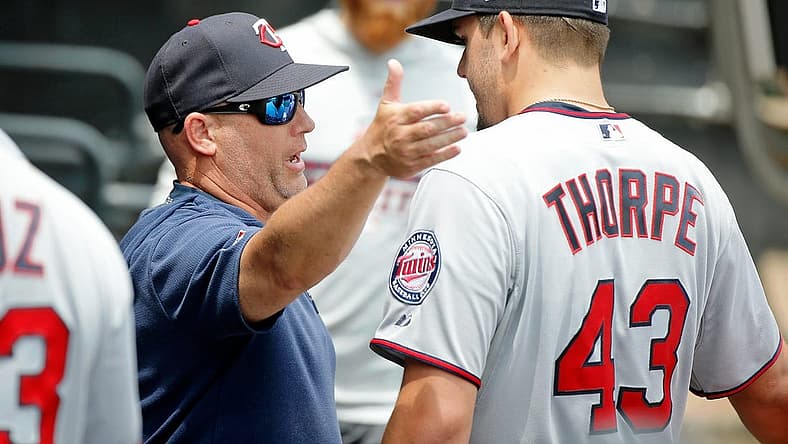 Jun 30, 2019; Chicago, IL, USA; Minnesota Twins starting pitcher Lewis Thorpe (43) talks with pitching coach Wes Johnson (47) in the dugout after pitching against the Chicago White Sox during the first inning in his MLB debut at Guaranteed Rate Field. Mandatory Credit: Jon Durr-USA TODAY Sports