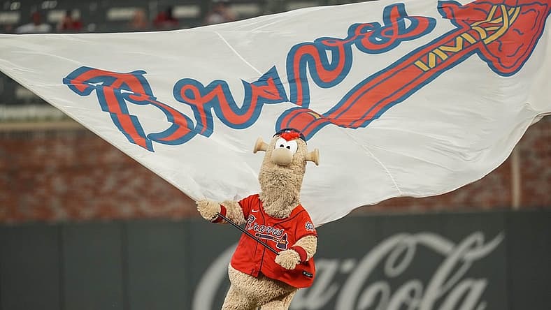 Aug 6, 2021; Cumberland, Georgia, USA; Atlanta Braves mascot Blooper waves the flag after the Braves defeated the Washington Nationals at Truist Park. Mandatory Credit: Dale Zanine-USA TODAY Sports