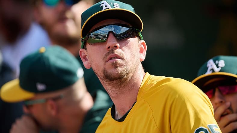May 15, 2022; Oakland, California, USA; Oakland Athletics right fielder Stephen Piscotty (25) watches play from the dugout against the Los Angeles Angels during the ninth inning at RingCentral Coliseum. Mandatory Credit: Robert Edwards-USA TODAY Sports