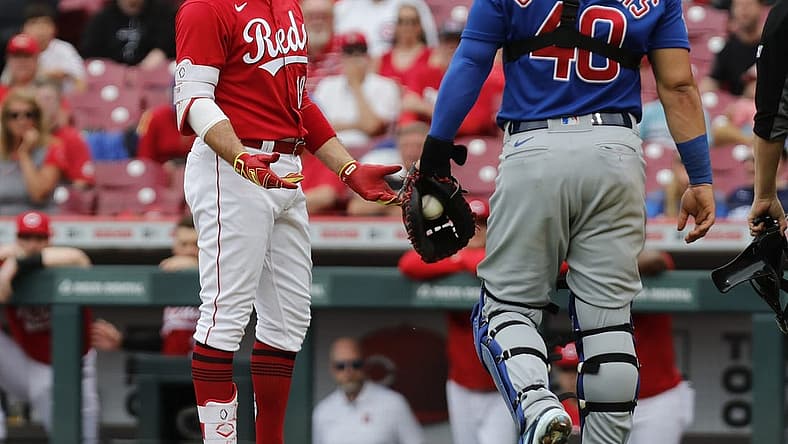 May 26, 2022; Cincinnati, Ohio, USA; Cincinnati Reds first baseman Joey Votto (19) has words with Chicago Cubs catcher Willson Contreras (40) during the seventh inning at Great American Ball Park. Mandatory Credit: David Kohl-USA TODAY Sports