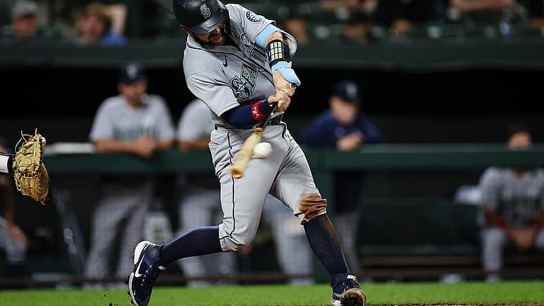 Jun 2, 2022; Baltimore, Maryland, USA; Seattle Mariners catcher Luis Torrens (22) hits a two RBI single against the Baltimore Orioles during the sixth inning at Oriole Park at Camden Yards. Mandatory Credit: Scott Taetsch-USA TODAY Sports