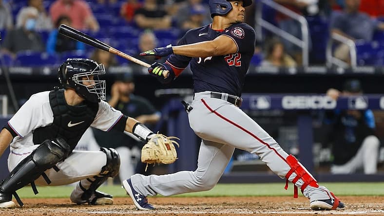 Jun 9, 2022; Miami, Florida, USA; Washington Nationals right fielder Juan Soto (22) hits a two-run RBI single during the fifth inning against the Miami Marlins at loanDepot Park. Mandatory Credit: Sam Navarro-USA TODAY Sports