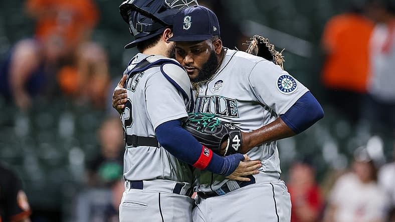 Jun 2, 2022; Baltimore, Maryland, USA; Seattle Mariners catcher Luis Torrens (22) celebrates with relief pitcher Diego Castillo (63) after the final pitch of the game against the Baltimore Orioles at Oriole Park at Camden Yards. Mandatory Credit: Scott Taetsch-USA TODAY Sports