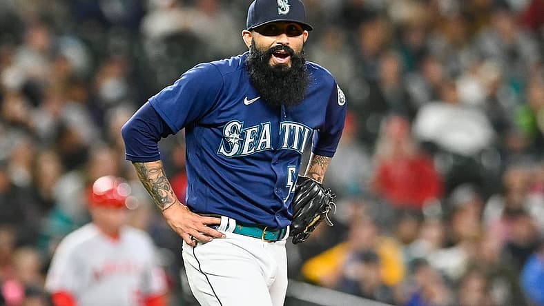 Jun 18, 2022; Seattle, Washington, USA; Seattle Mariners relief pitcher Sergio Romo (54) reacts after giving up a single against the Los Angeles Angels during the seventh inning at T-Mobile Park. Mandatory Credit: Steven Bisig-USA TODAY Sports