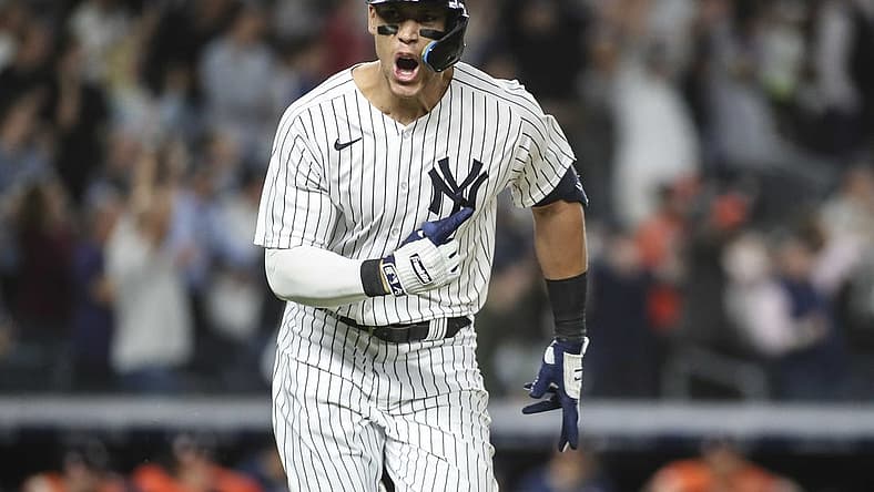 Jun 23, 2022; Bronx, New York, USA; New York Yankees center fielder Aaron Judge (99) reacts after hitting a game winning RBI single in the ninth inning to defeat the Houston Astros 7-6 at Yankee Stadium. Mandatory Credit: Wendell Cruz-USA TODAY Sports