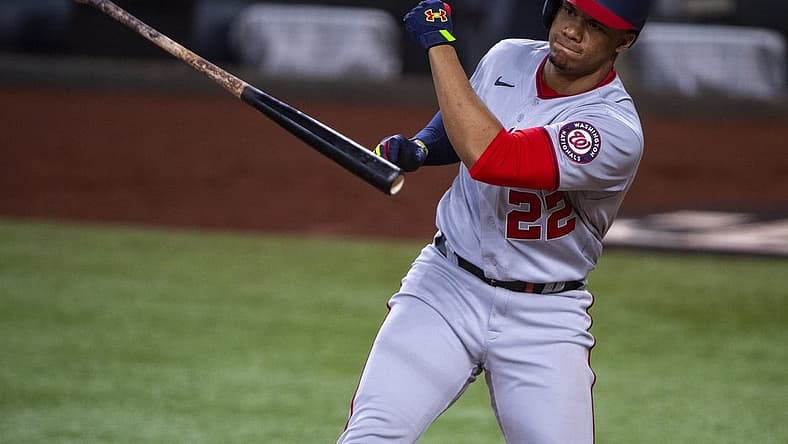 Jun 25, 2022; Arlington, Texas, USA; Washington Nationals right fielder Juan Soto (22) tosses his bat after he strikes out with runners in scoring position to end the seventh inning against the Texas Rangers at Globe Life Field. Mandatory Credit: Jerome Miron-USA TODAY Sports