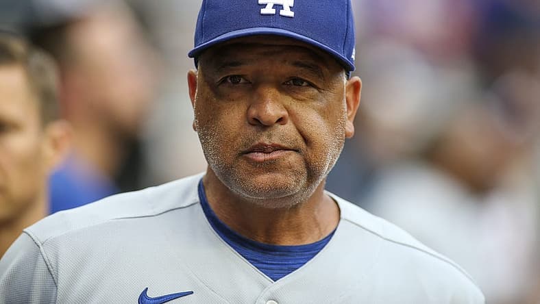 Jun 25, 2022; Atlanta, Georgia, USA; Los Angeles Dodgers manager Dave Roberts (30) in the dugout before a game against the Atlanta Braves at Truist Park. Mandatory Credit: Brett Davis-USA TODAY Sports