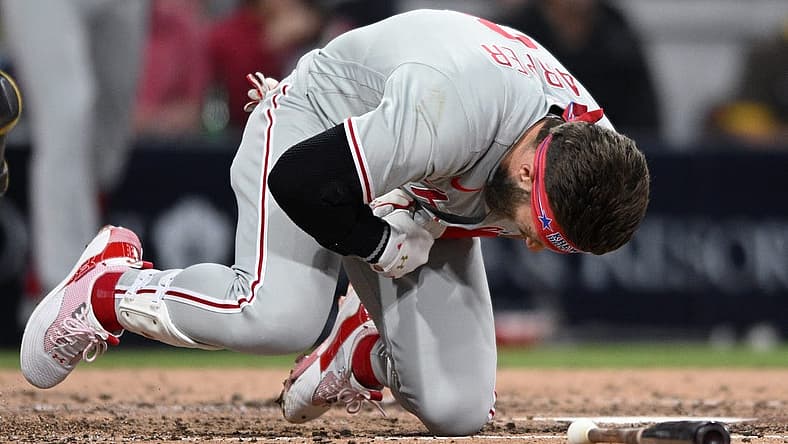 Jun 25, 2022; San Diego, California, USA; Philadelphia Phillies designated hitter Bryce Harper (3) reacts after being hit by a pitch during the fourth inning against the San Diego Padres at Petco Park. Mandatory Credit: Orlando Ramirez-USA TODAY Sports