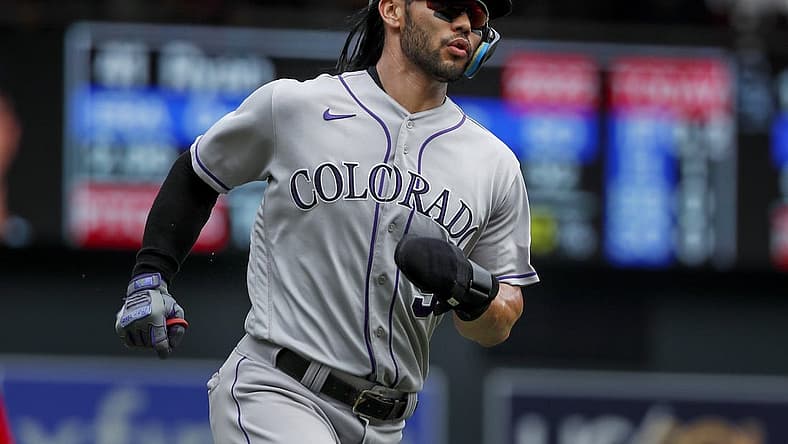 Jun 26, 2022; Minneapolis, Minnesota, USA; Colorado Rockies left fielder Connor Joe (9) scores against the Minnesota Twins in the first inning at Target Field. Mandatory Credit: Bruce Kluckhohn-USA TODAY Sports