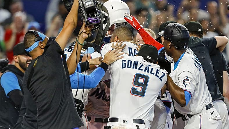 Jun 26, 2022; Miami, Florida, USA; Miami Marlins celebrate at home plate after a walk-off home run by catcher Nick Fortes (54) in the ninth inning against the New York Mets at loanDepot Park. Mandatory Credit: Sam Navarro-USA TODAY Sports