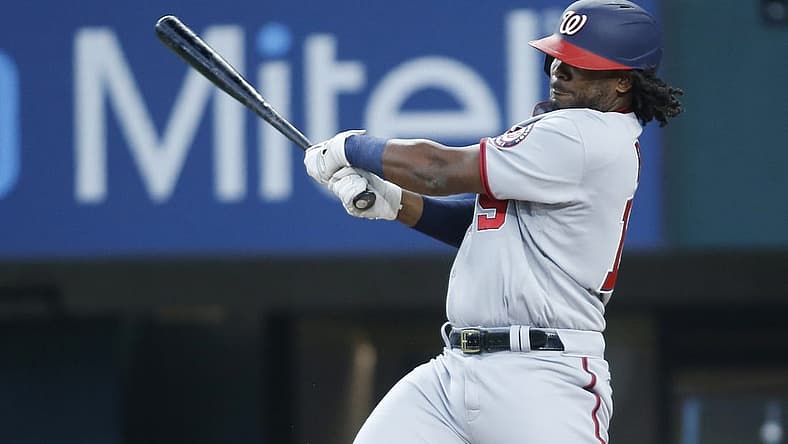 Jun 26, 2022; Arlington, Texas, USA; Washington Nationals first baseman Josh Bell (19) singles in the first inning against the Texas Rangers at Globe Life Field. Mandatory Credit: Tim Heitman-USA TODAY Sports