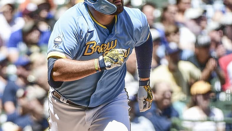 Jun 26, 2022; Milwaukee, Wisconsin, USA; Milwaukee Brewers first baseman Rowdy Tellez (11) watches after hitting a two-run home run in the second inning during game against the Toronto Blue Jays at American Family Field. Mandatory Credit: Benny Sieu-USA TODAY Sports