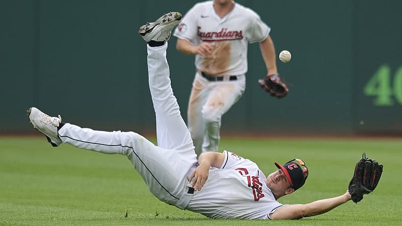 Jun 26, 2022; Cleveland, Ohio, USA; Cleveland Guardians left fielder Ernie Clement (28) dives for an RBI single hit by Boston Red Sox second baseman Trevor Story (not pictured) during the sixth inning at Progressive Field. Mandatory Credit: Ken Blaze-USA TODAY Sports