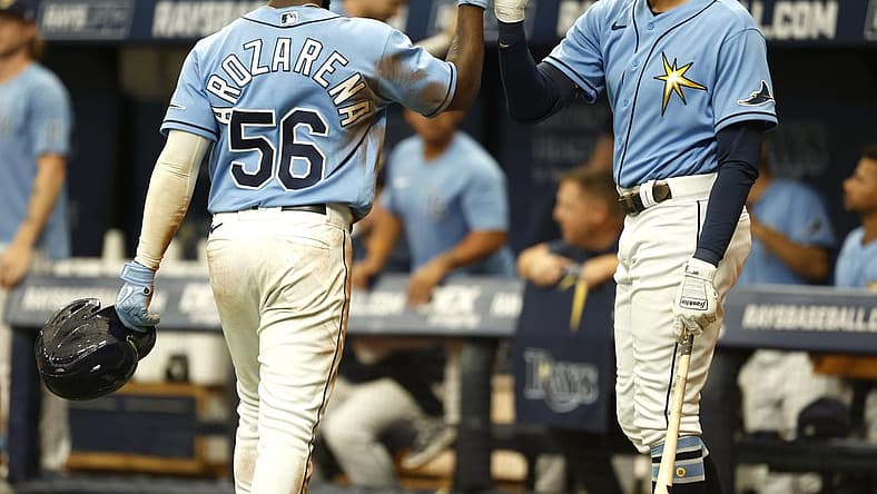 Jun 26, 2022; St. Petersburg, Florida, USA;  Tampa Bay Rays right fielder Randy Arozarena (56) is congratulated by  center fielder Josh Lowe (15) after he scores a run against the Pittsburgh Pirates during the seventh inning at Tropicana Field. Mandatory Credit: Kim Klement-USA TODAY Sports