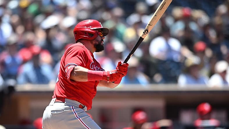 Jun 26, 2022; San Diego, California, USA; Philadelphia Phillies left fielder Kyle Schwarber (12) hits an RBI double during the second inning against the San Diego Padres at Petco Park. Mandatory Credit: Orlando Ramirez-USA TODAY Sports