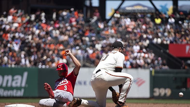 Jun 26, 2022; San Francisco, California, USA; Cincinnati Reds right fielder Albert Almora Jr. (3) slides safely into third base ahead of the relay to San Francisco Giants third baseman Evan Longoria (10) during the third inning at Oracle Park. Mandatory Credit: D. Ross Cameron-USA TODAY Sports