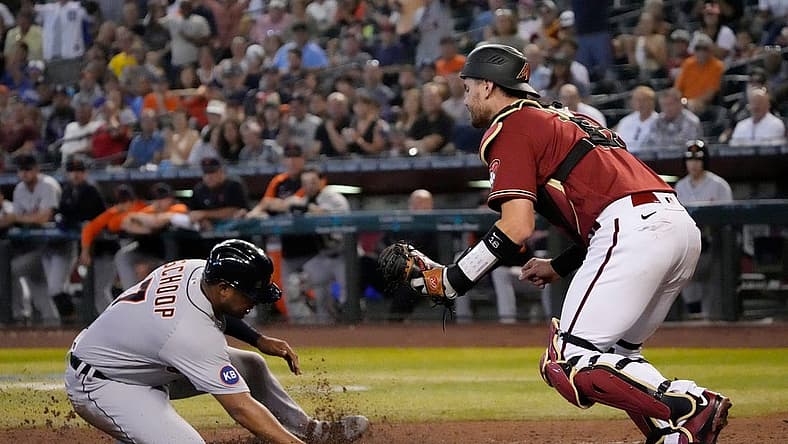 Jun 26, 2022; Phoenix, Ariz., U.S.; Detroit Tigers second baseman Jonathan Schoop (7) scores ahead of the tag by Arizona Diamondbacks catcher Carson Kelly (18) during the third inning at Chase Field. Mandatory Credit: Michael Chow-Arizona Republic
Mlb Tigers At Dbacks