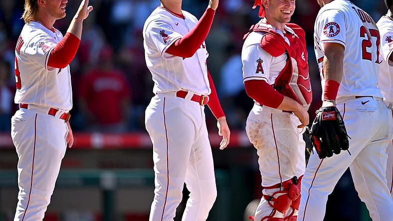 Jun 26, 2022; Anaheim, California, USA; Los Angeles Angels first baseman David MacKinnon (39) designated hitter Shohei Ohtani (17) and catcher Max Stassi (33) high five center fielder Mike Trout (27) after the final out of the ninth inning defeating the Seattle Mariners at Angel Stadium. Mandatory Credit: Jayne Kamin-Oncea-USA TODAY Sports