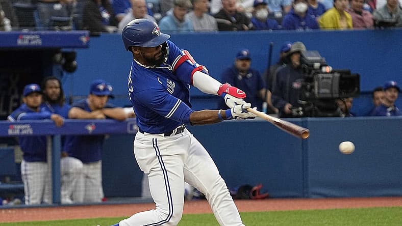 Jun 27, 2022; Toronto, Ontario, CAN; Toronto Blue Jays right fielder Teoscar Hernandez (37) hits a single against the Boston Red Sox during the third inning at Rogers Centre. Mandatory Credit: John E. Sokolowski-USA TODAY Sports
