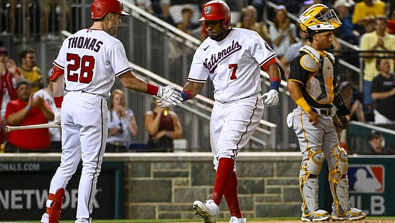Jun 27, 2022; Washington, District of Columbia, USA; Washington Nationals third baseman Maikel Franco (7) is congratulated by left fielder Lane Thomas (28) after hitting a two run home run against the Pittsburgh Pirates during the eighth inning at Nationals Park. Mandatory Credit: Brad Mills-USA TODAY Sports