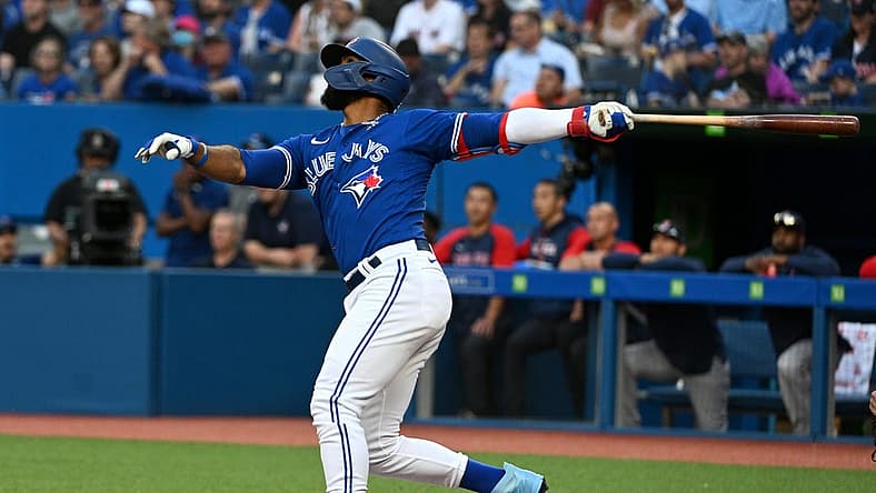 Jun 28, 2022; Toronto, Ontario, CAN; Toronto Blue Jays right fielder Teoscar Hernandez (37) hits an RBI double against the Boston Red Sox in the first inning at Rogers Centre. Mandatory Credit: Dan Hamilton-USA TODAY Sports
