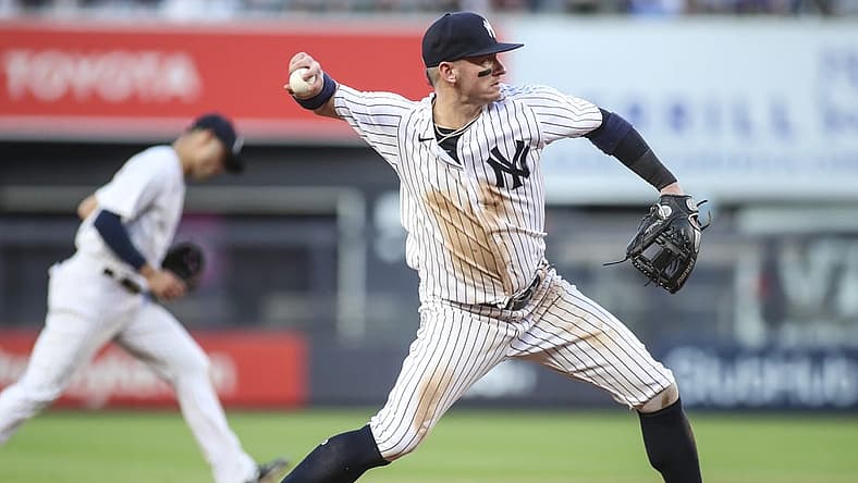 Jun 28, 2022; Bronx, New York, USA; New York Yankees third baseman Josh Donaldson (28) throws a runner out at first base in the third inning against the Oakland Athletics at Yankee Stadium. Mandatory Credit: Wendell Cruz-USA TODAY Sports