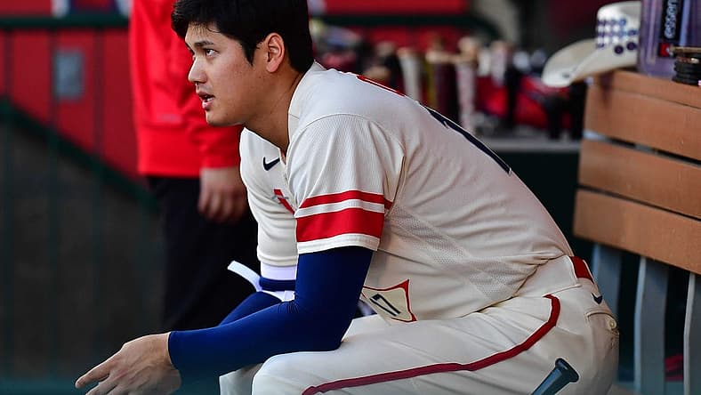 June 28, 2022; Anaheim, California, USA; Los Angeles Angels designated hitter Shohei Ohtani (17) watches game action against the Chicago White Sox during the first inning at Angel Stadium. Mandatory Credit: Gary A. Vasquez-USA TODAY Sports