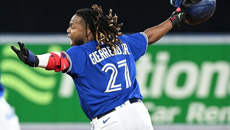 Jun 28, 2022; Toronto, Ontario, CAN; Toronto Blue Jays first baseman Vladimir Guerrero Jr. (27) celebrates after hitting a walkoff RBI single against the Boston Red Sox in the ninth inning at Rogers Centre. Mandatory Credit: Dan Hamilton-USA TODAY Sports
