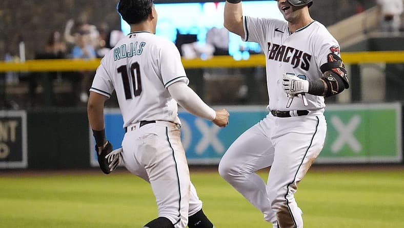 Jun 28, 2022; Phoenix, Ariz., U.S.; Arizona Diamondbacks' Arizona Diamondbacks' Christian Walker (53) and Josh Rojas (10) celebrate after beating the San Diego Padres 7-6 on a fielder's choice in the ninth inning at Chase Field. Mandatory Credit: Michael Chow-Arizona Republic
Mlb Padres At D Backs
