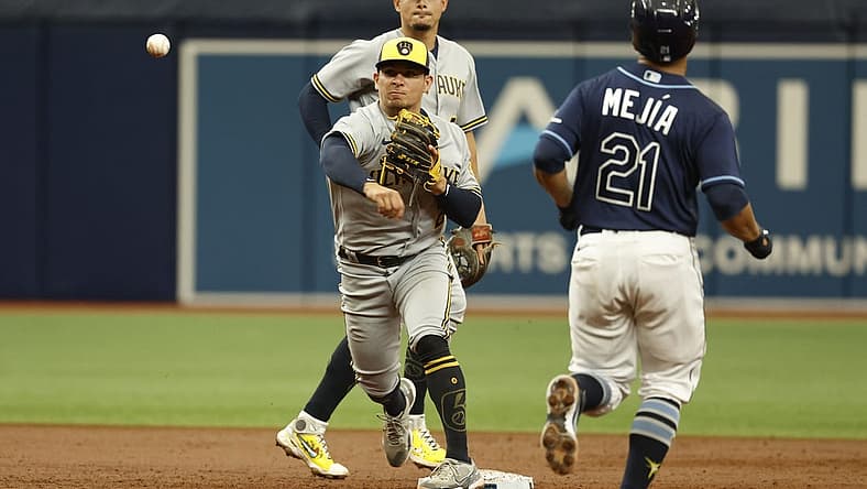 Jun 29, 2022; St. Petersburg, Florida, USA;  Milwaukee Brewers shortstop Luis Urias (2) forces out Tampa Bay Rays catcher Francisco Mejia (21) and throws the ball to first base for a double play during the third inning sat Tropicana Field. Mandatory Credit: Kim Klement-USA TODAY Sports