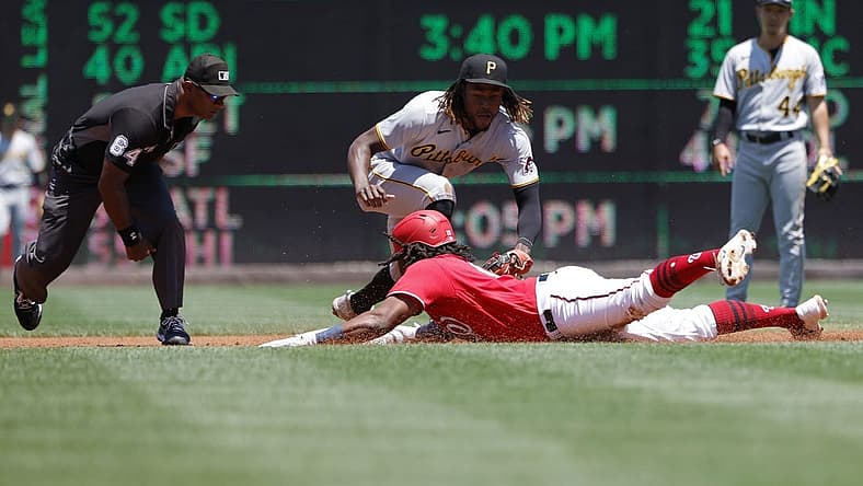 Jun 29, 2022; Washington, District of Columbia, USA; Washington Nationals first baseman Josh Bell (19) slides into second base for a double ahead of the tag of Pittsburgh Pirates shortstop Oneil Cruz (15) during the first inning at Nationals Park. Mandatory Credit: Geoff Burke-USA TODAY Sports