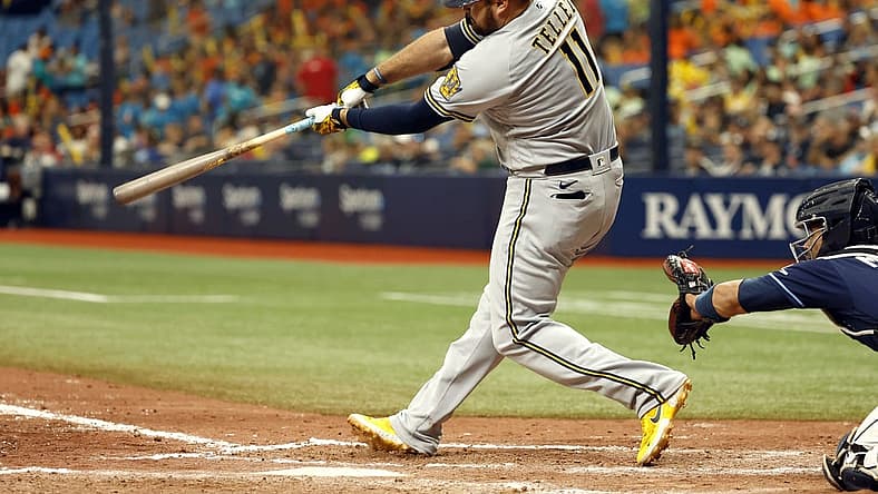Jun 29, 2022; St. Petersburg, Florida, USA;Milwaukee Brewers first baseman Rowdy Tellez (11) hits the go-ahead home run against the Tampa Bay Rays during the eighth inning at Tropicana Field. Mandatory Credit: Kim Klement-USA TODAY Sports