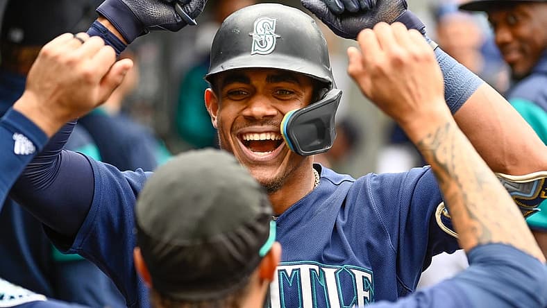 Jun 29, 2022; Seattle, Washington, USA; Seattle Mariners center fielder Julio Rodriguez (44) celebrates in the dugout after hitting a 2-run home run against the Baltimore Orioles during the fourth inning at T-Mobile Park. Mandatory Credit: Steven Bisig-USA TODAY Sports