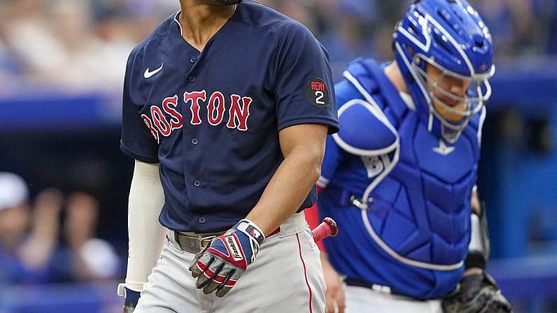 Jun 29, 2022; Toronto, Ontario, CAN; Boston Red Sox shortstop Xander Bogaerts (2) reacts after striking out against the Toronto Blue Jays during the second inning at Rogers Centre. Mandatory Credit: Kevin Sousa-USA TODAY Sports