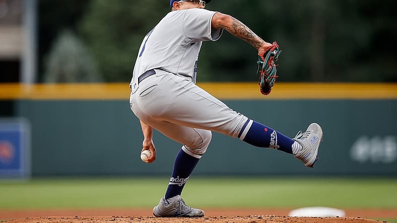 Jun 29, 2022; Denver, Colorado, USA; Los Angeles Dodgers starting pitcher Julio Urias (7) pitches in the first inning against the Colorado Rockies at Coors Field. Mandatory Credit: Isaiah J. Downing-USA TODAY Sports
