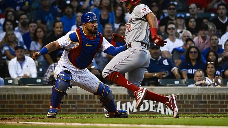 Jun 29, 2022; Chicago, Illinois, USA; Chicago Cubs catcher Willson Contreras (40) tags out Cincinnati Reds left fielder Tommy Pham (28) at home plate during the fourth inning at Wrigley Field. Mandatory Credit: Matt Marton-USA TODAY Sports