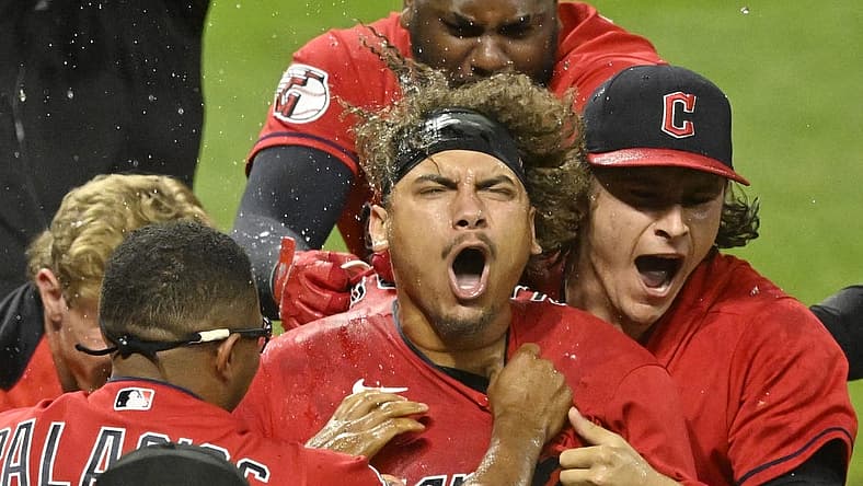 Jun 29, 2022; Cleveland, Ohio, USA; Cleveland Guardians first baseman Josh Naylor (center) celebrates his game-winning two-run home run in the tenth inning against the Minnesota Twins at Progressive Field. Mandatory Credit: David Richard-USA TODAY Sports