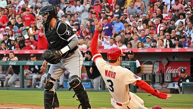 Jun 29, 2022; Anaheim, California, USA; Los Los Angeles Angels right fielder Taylor Ward (3) scores past Chicago White Sox catcher Reese McGuire (21) on a double hit by Los Angeles Angels center fielder Mike Trout (not pictured) in the first inning at Angel Stadium. Mandatory Credit: Jayne Kamin-Oncea-USA TODAY Sports