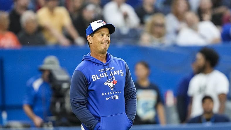 Jun 29, 2022; Toronto, Ontario, CAN; Toronto Blue Jays manager Charlie Montoyo (25) reacts to a call during the second inning against the Boston Red Sox at Rogers Centre. Mandatory Credit: Kevin Sousa-USA TODAY Sports