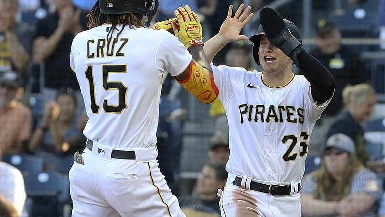 Jun 30, 2022; Pittsburgh, Pennsylvania, USA; Pittsburgh Pirates first baseman Josh VanMeter (right) congratulates shortstop Oneil Cruz (15) on his two-run home run against the Milwaukee Brewers during the second inning at PNC Park. Mandatory Credit: Charles LeClaire-USA TODAY Sports
