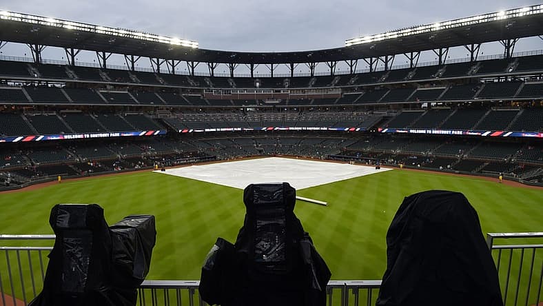 Jul 31, 2018; Atlanta, GA, USA; Television cameras are covered up during a rain delay prior to the game against the Atlanta Braves and the Miami Marlins at SunTrust Park. Mandatory Credit: Adam Hagy-USA TODAY Sports