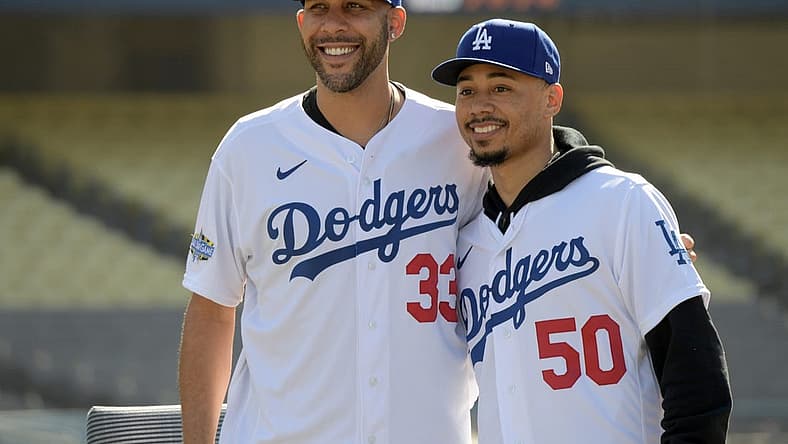 Feb 12, 2020; Los Angeles, California, USA;  Los Angeles Dodgers players David Price (33) and Mookie Betts (50) pose during a press conference at Dodger Stadium. Mandatory Credit: Kirby Lee-USA TODAY Sports